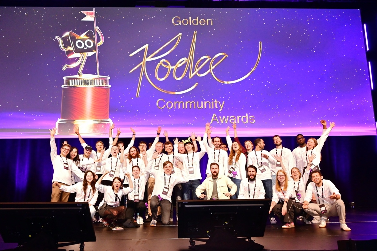 KotlinConf 2026 volunteer team on the Golden Kodee stage